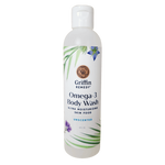 A bottle of Griffin Remedy Omega-3 Creamy Body Wash with a label that includes the product name and 'Unscented' beside it. The bottle is white with green and blue floral design accents. Natural skincare.