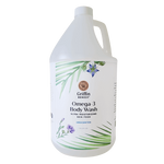 A gallon bottle of Griffin Remedy Omega-3 Creamy Body Wash with a label that includes the product name and 'Unscented' beside it. The bottle is white with green and blue floral design accents. Natural skincare.