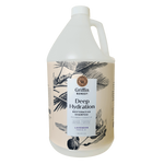 A gallon bottle of Griffin Remedy Deep Hydration Restorative Shampoo with a label featuring botanical illustrations and text indicating the product name and type, lavender-scented. Natural hair care.